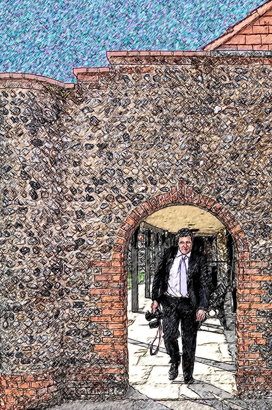 Photographer enters under the arch